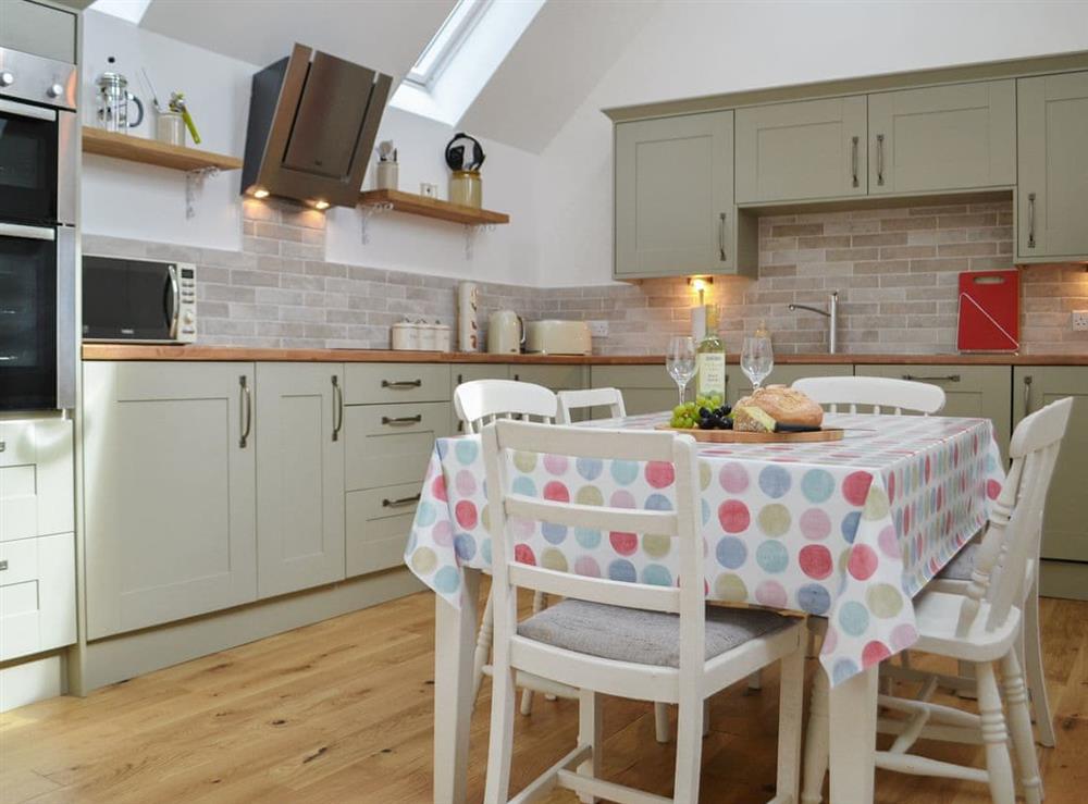 Well equipped kitchen with breakfast area at Wester Laggan Cottage in Dulnain Bridge, near Grantown-on-Spey, Highlands, Morayshire