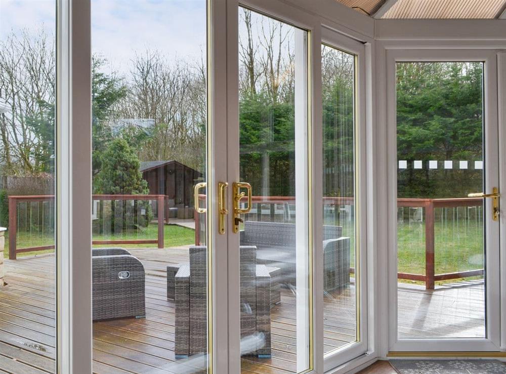 Second conservatory area with French doors to the patio at Western Fells Cottage in Rowrah, near Frizington, Cumbria