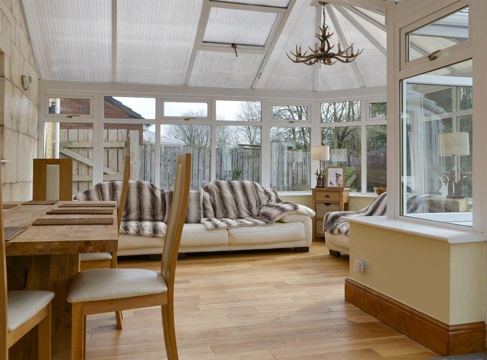 Spacious conservatory at Western Fells Cottage in Rowrah, near Frizington, Cumbria