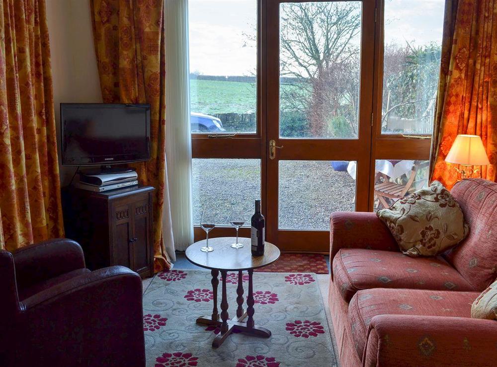 Living and dining area at Barn Owl Cottage, 