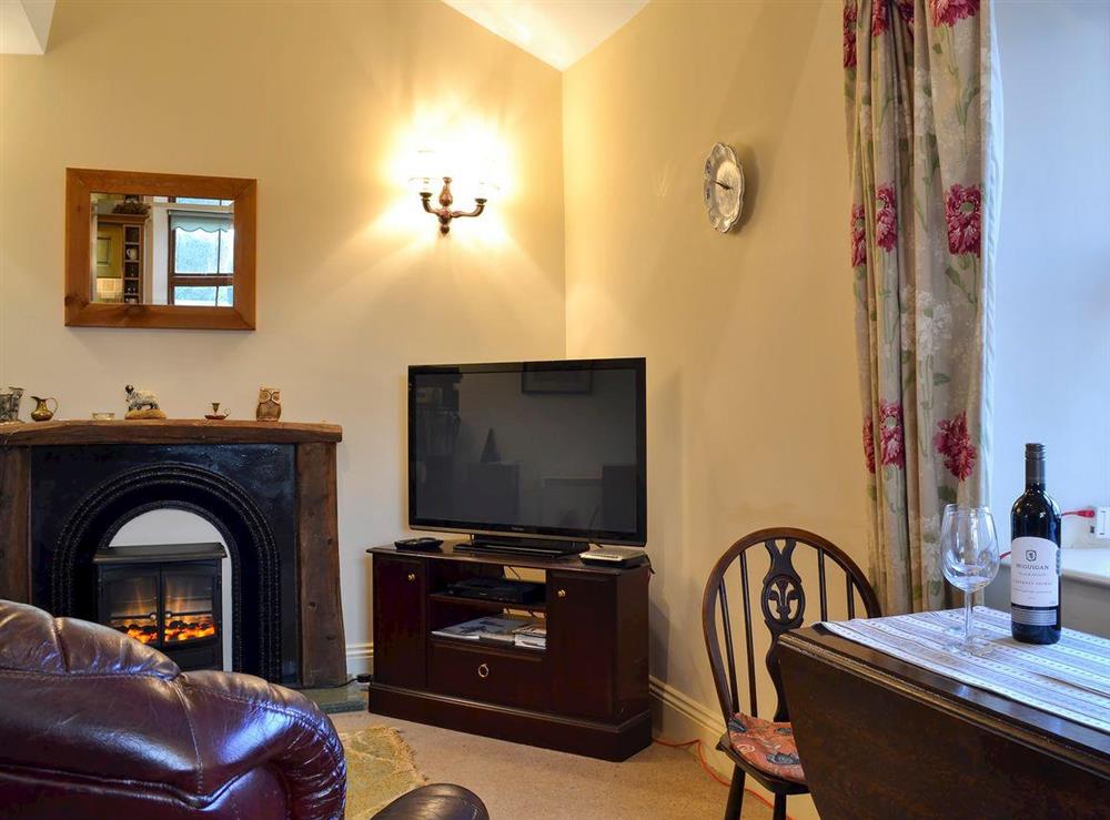 Cosy living and dining area at Willow Barn Cottage, 