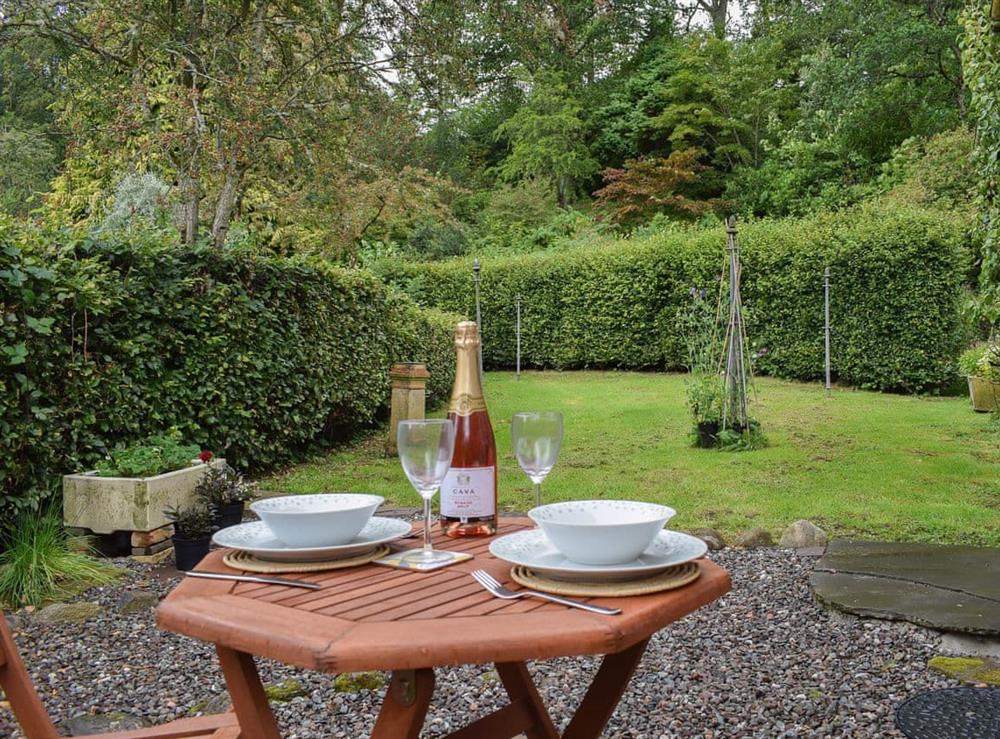 Enjoy a glass or two of wine whilst admiring the garden at The Old Stables at Westerton, 