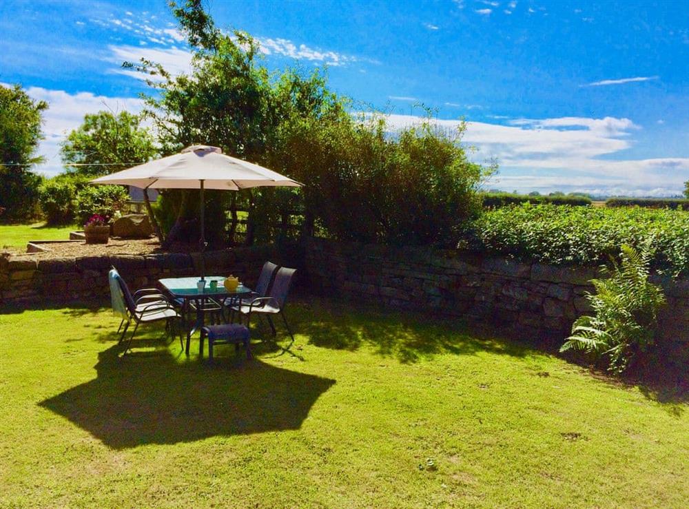 Private rear garden at Westfield Farm Cottage in East Holywell, near Whitley Bay, Northumberland