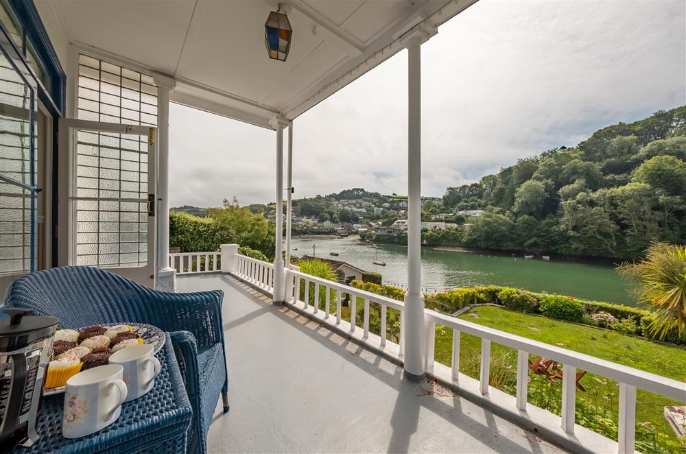Enjoy a coffee on the veranda overlooking the water