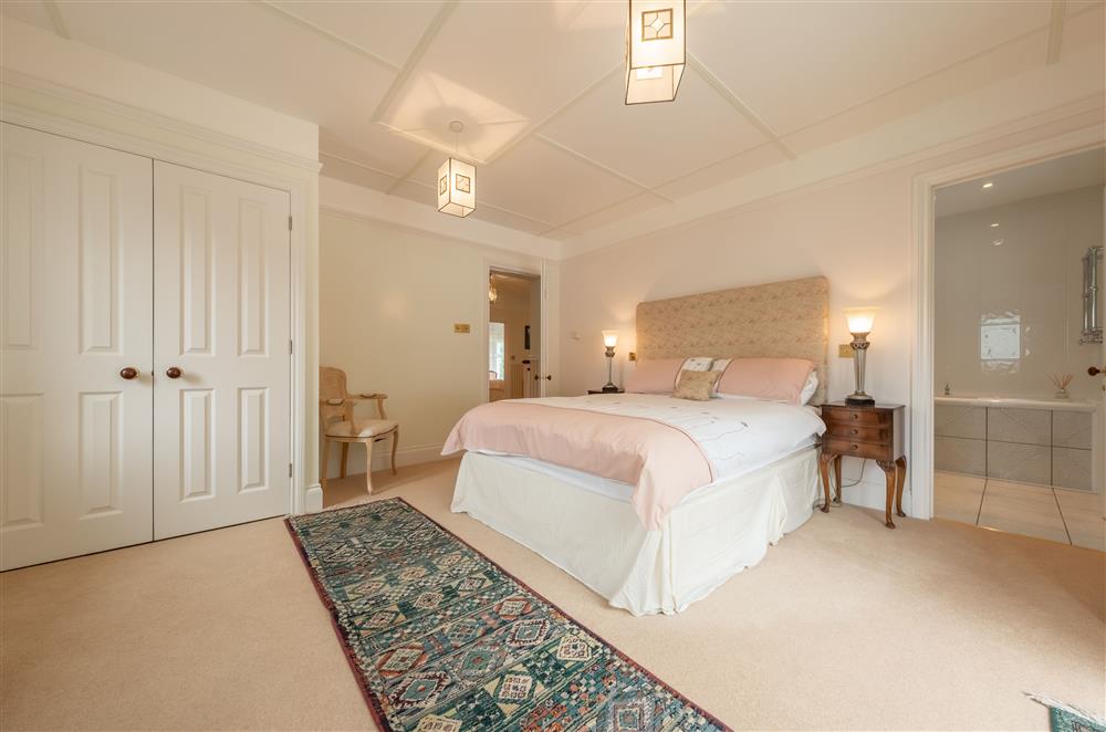First Floor bedroom one with king-size bed, en-suite bathroom and french doors leading out to the garden (photo 2)