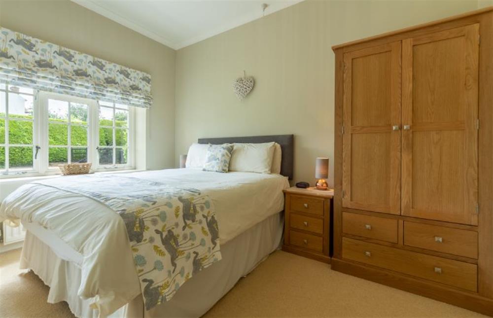 Ground floor: Bedroom two with king-size bed (photo 2) at Westgate Cottage, Thornham near Hunstanton