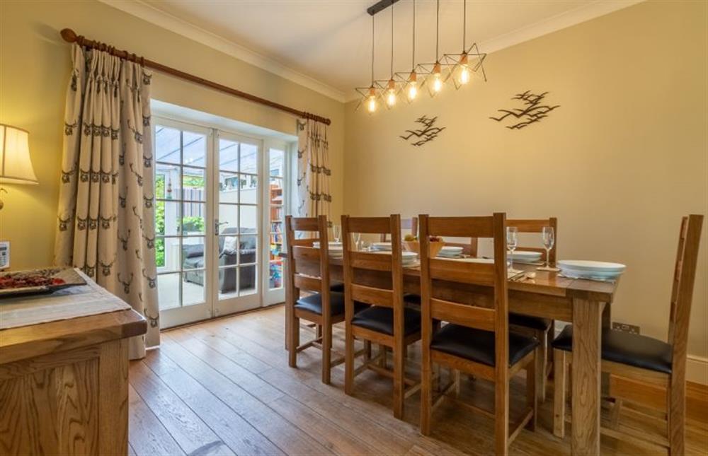 Ground floor: Dining room with french doors leading to conservatory (photo 2) at Westgate Cottage, Thornham near Hunstanton