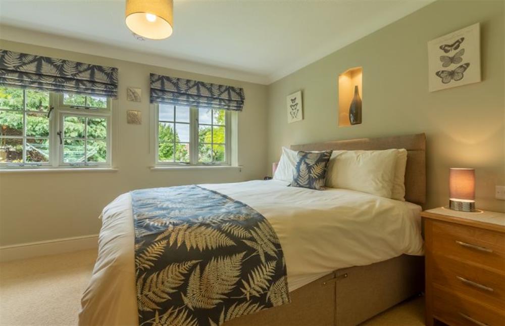 Ground floor: Master bedroom with king-size bed (photo 2) at Westgate Cottage, Thornham near Hunstanton