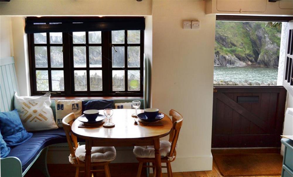 The dining area and views of Polperro harbour at Westhaven in Polperro