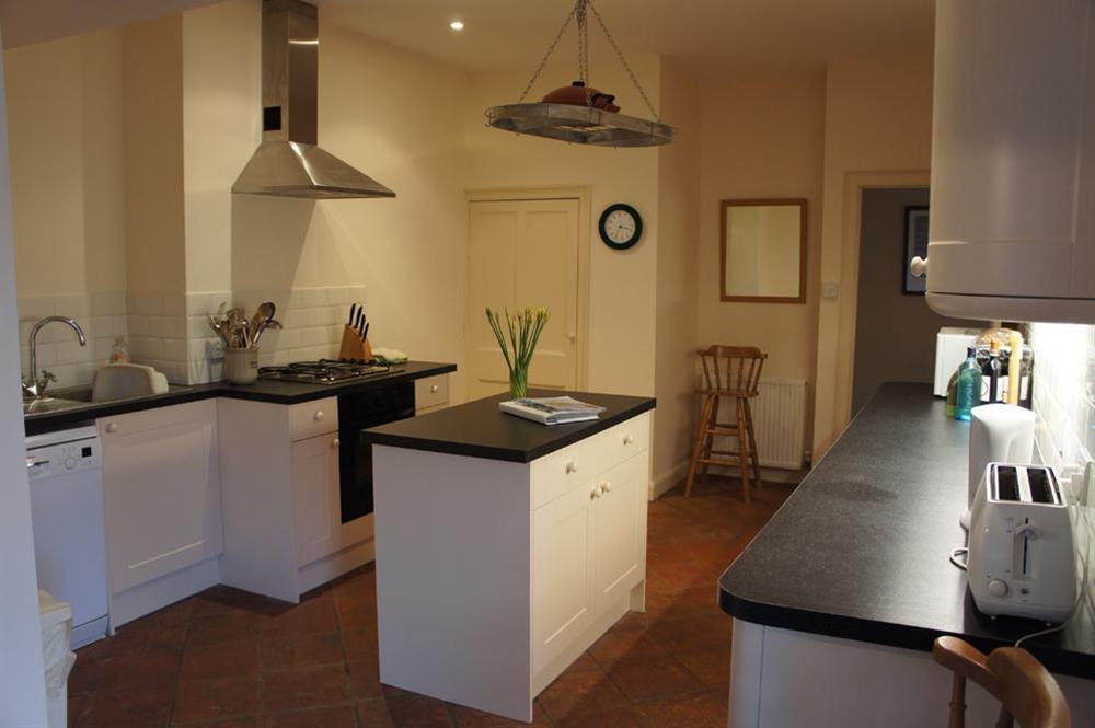 Well equipped kitchen with Mexican slate tiles throughout at Westland in 42 Devon Road, Salcombe