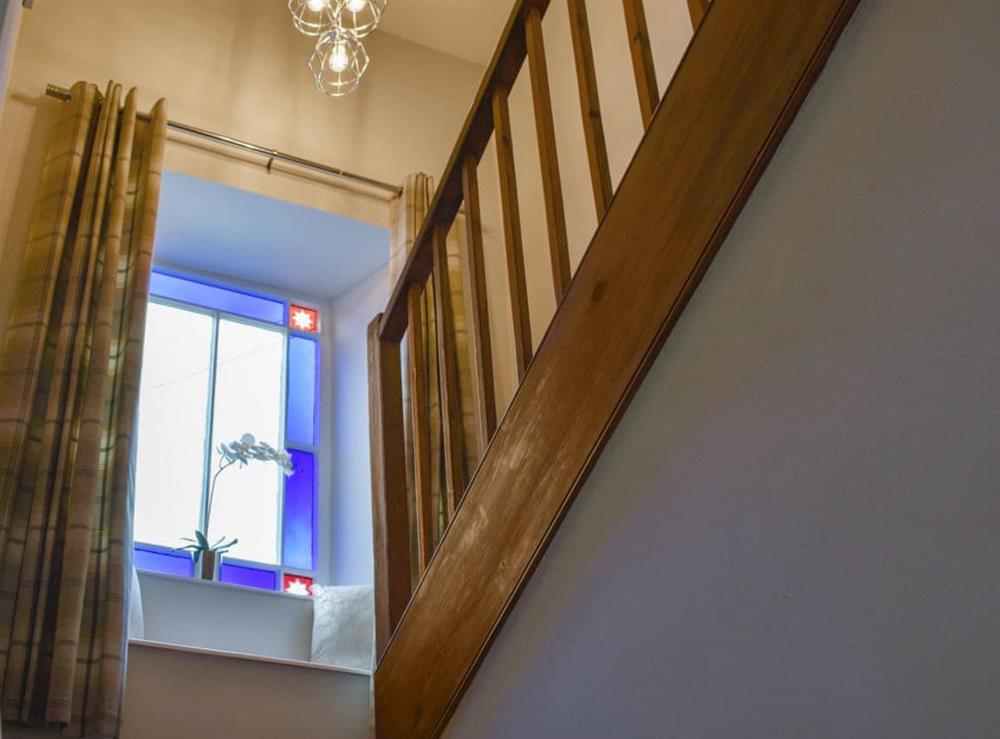 Turning staircase with charming stained glass window