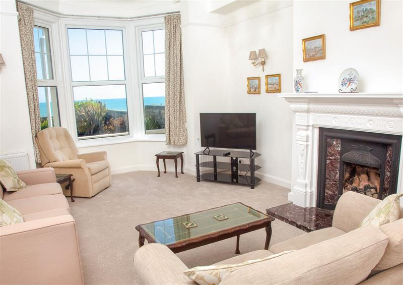 Relax in the living area at Weymouth Bay Apartment A, Weymouth