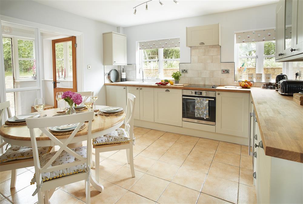 Kitchen with table and four chairs at Wharf Cottage, Wootton Wawen