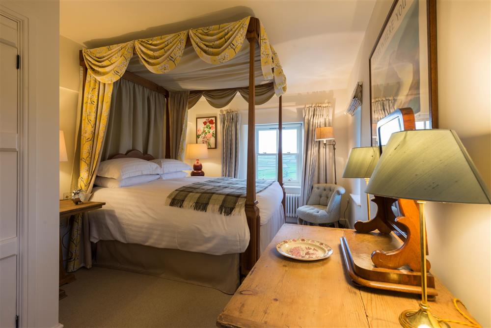 Bedroom three with a 5’ king-size four poster bed at Wharfe View Cottage, Skipton
