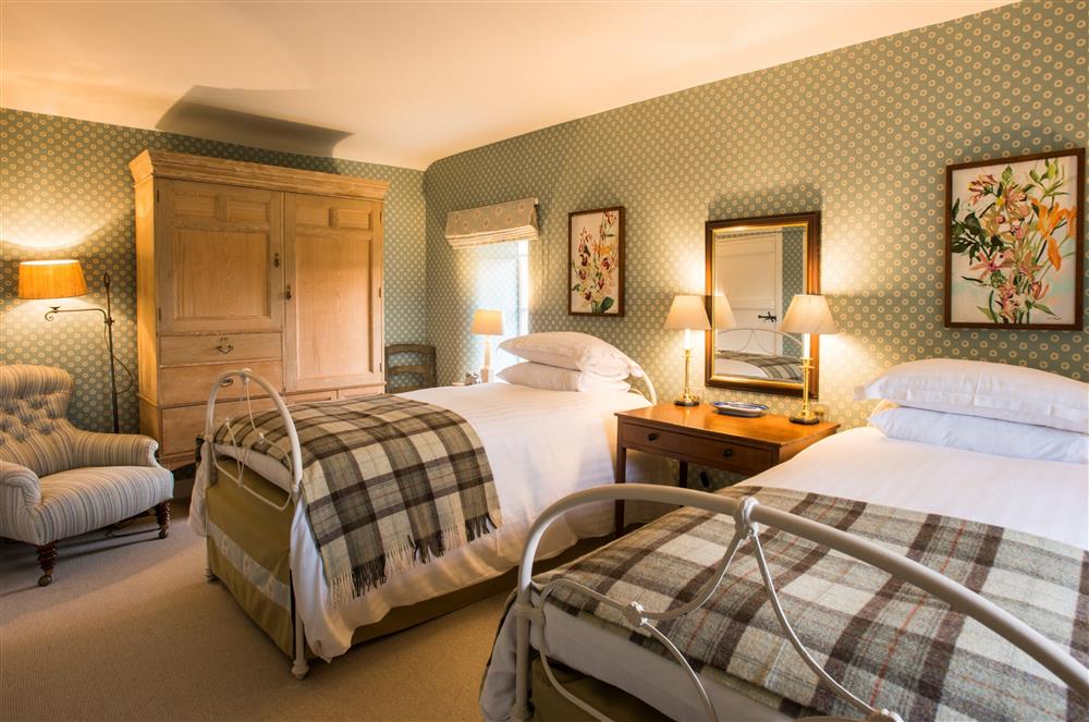 Bedroom two with twin 3’ single beds and en-suite shower room at Wharfe View Cottage, Skipton
