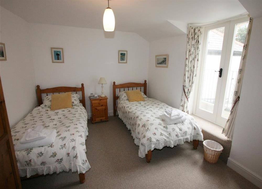 Rearr twin bedroom with balcony at Wharfinger in Bude