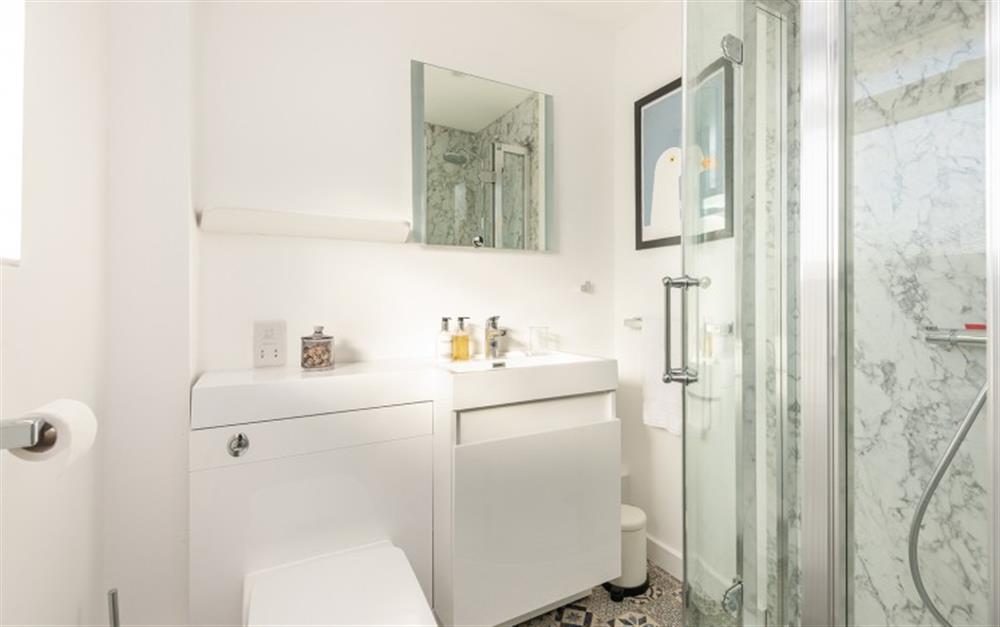 The bathroom is modern  at Wheal Charlotte Cottage in Marazion