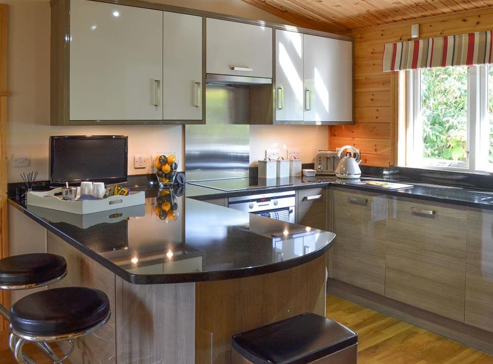 Well appointed kitchen with breakfast bar at Wheal Metal Lodge in Poldown, near Helston, Cornwall
