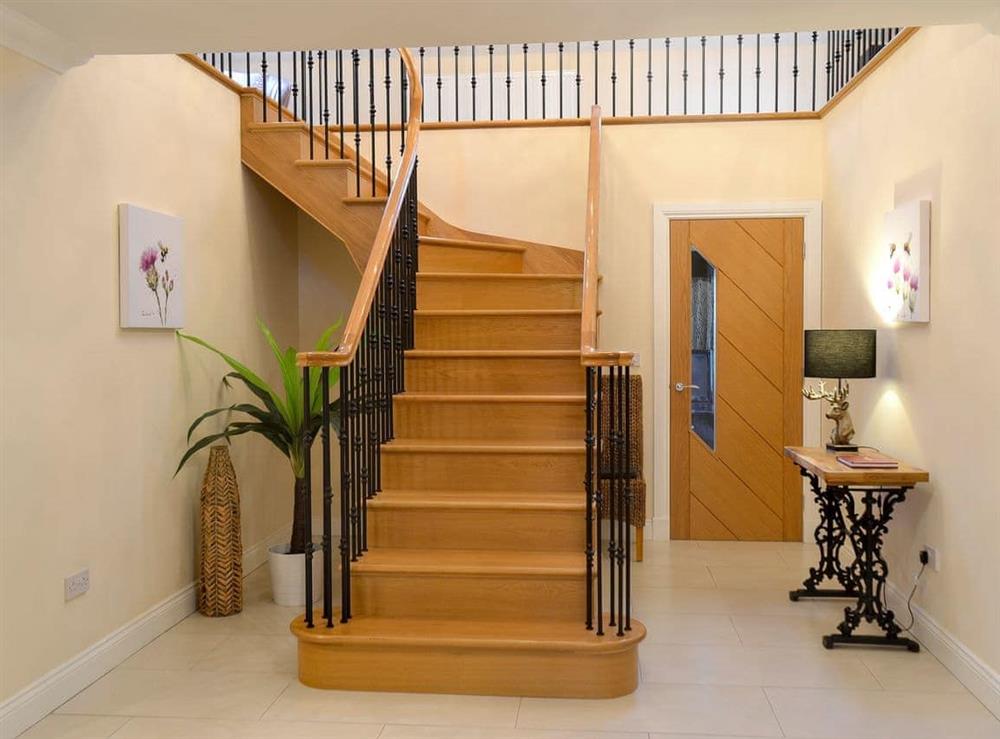 Welcoming hallway and stairs at Wheatfield House in Kilmaurs, near Kilmarnock, Ayrshire