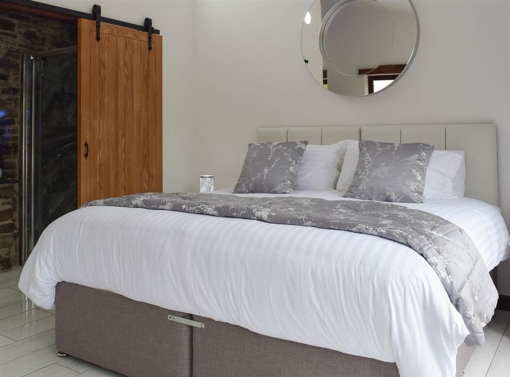 Double bedroom with en-suite at Wheelwright Barn in Ferryside, near Carmarthen, Dyfed