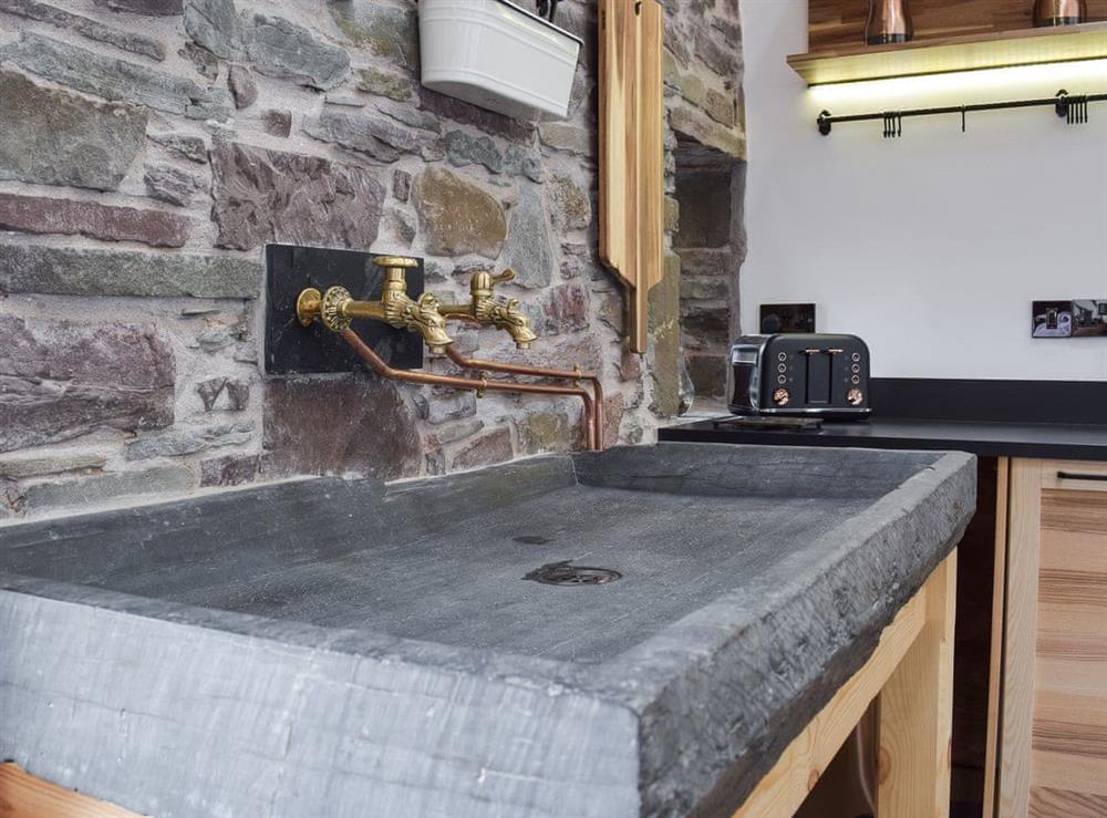 Kitchen with unique slate sink (photo 3) at Wheelwright Barn in Ferryside, near Carmarthen, Dyfed