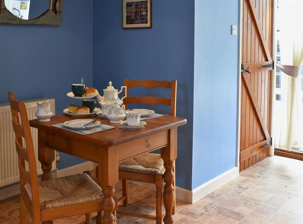 Dining area at Wheelwright Cottage in Beaworthy, Devon