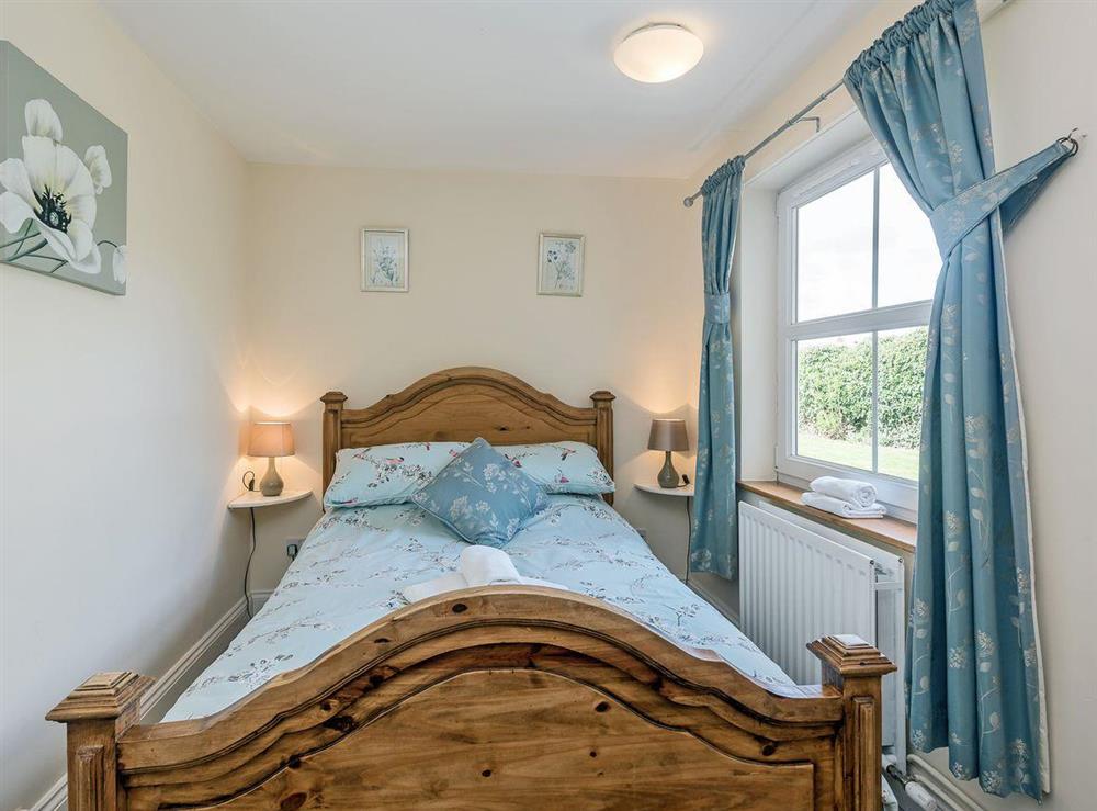 Comfortable double bedroom with river views at Wherryman’s Cottage in Coltishall, Norfolk., Great Britain