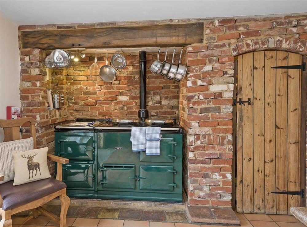 Kitchen/diner with French leading to garden at Wherryman’s Cottage in Coltishall, Norfolk., Great Britain