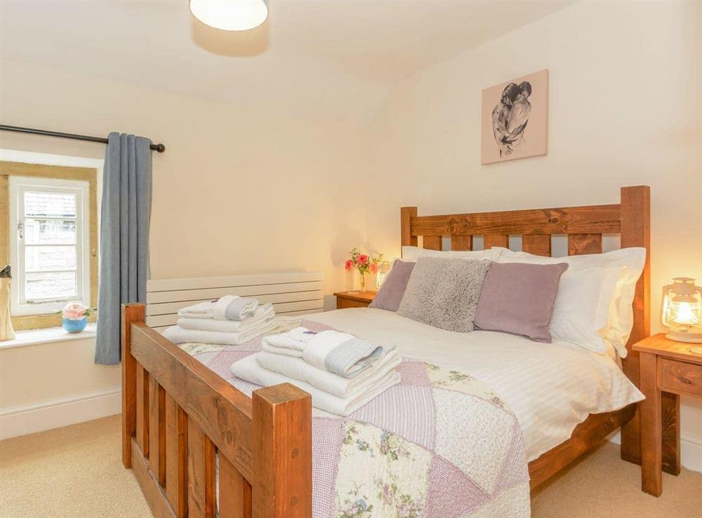 Charming master bedroom at Whibberley Cottage in Ashford-in-the-Water, near Bakewell, Derbyshire