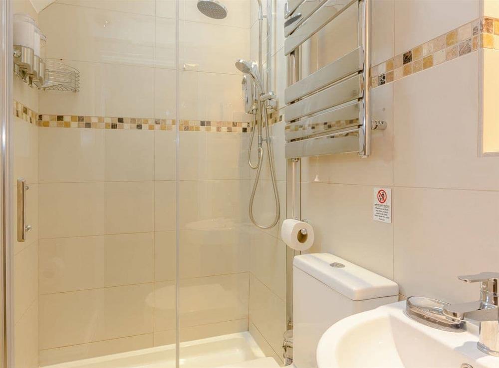 Ground floor shower room with heated towel rail at Whibberley Cottage in Ashford-in-the-Water, near Bakewell, Derbyshire
