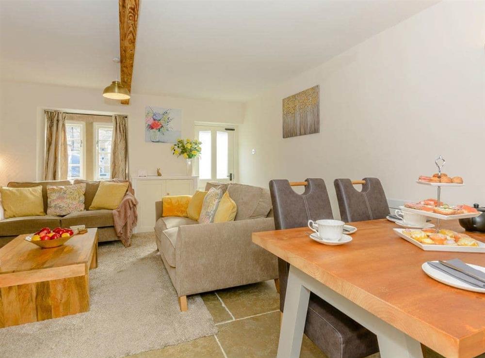 Spacious living and dining room at Whibberley Cottage in Ashford-in-the-Water, near Bakewell, Derbyshire