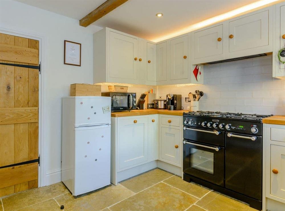 Well-equipped fitted kitchen at Whibberley Cottage in Ashford-in-the-Water, near Bakewell, Derbyshire