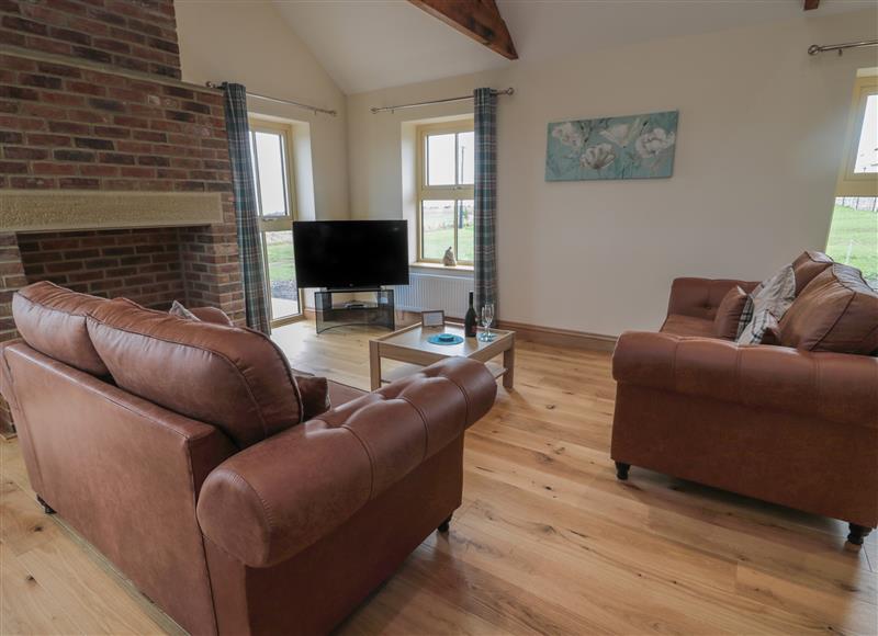 Relax in the living area at Whinney Cottage, Embleton