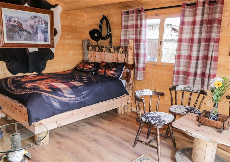 A bedroom in Whiskey Creek Cabin at Whiskey Creek Cabin, Castlerock