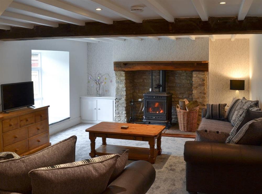 Cosy living room with wood burner at Whisperdale Barn in Silpho, near Harwood Dale, North Yorkshire