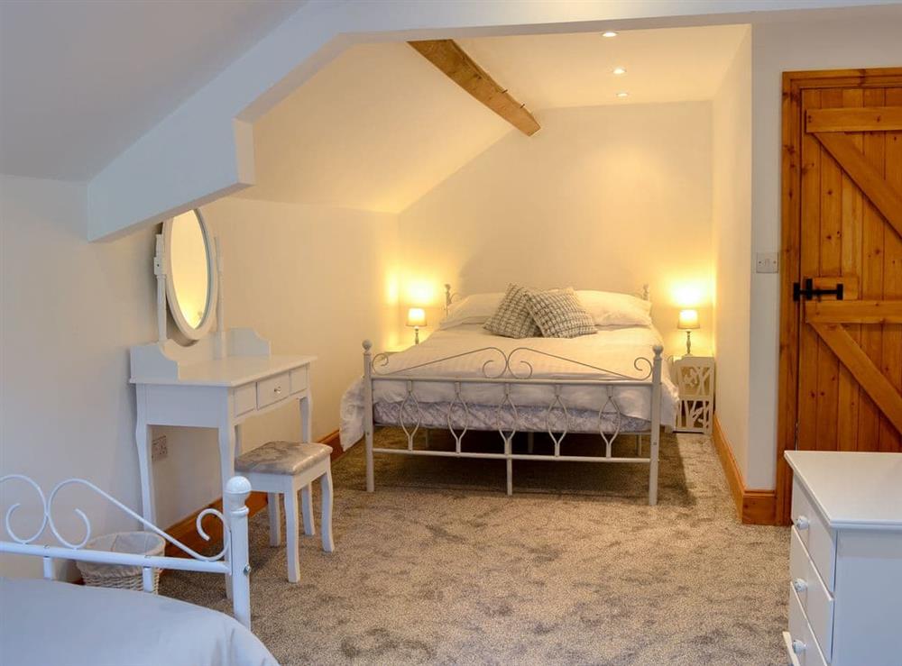 Family bedroom with en-suite at Whisperdale Barn in Silpho, near Harwood Dale, North Yorkshire