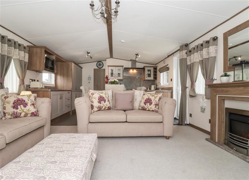 Enjoy the living room at Whispering Willows, Cayton Bay