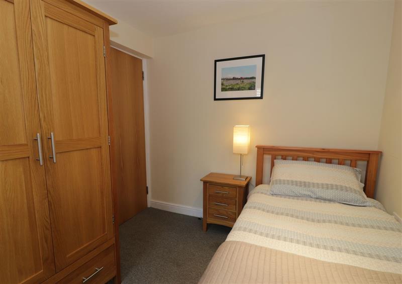 This is a bedroom at Whistle Stop Apartment, Porthmadog