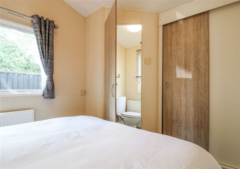 A bedroom in White Hart Caravan (photo 2) at White Hart Caravan, Catsfield near Battle