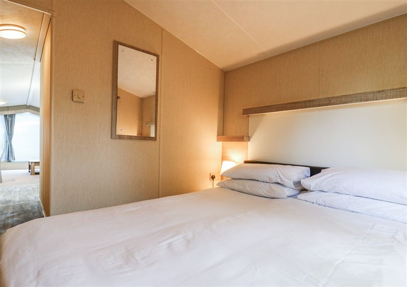 A bedroom in White Hart Caravan at White Hart Caravan, Catsfield near Battle