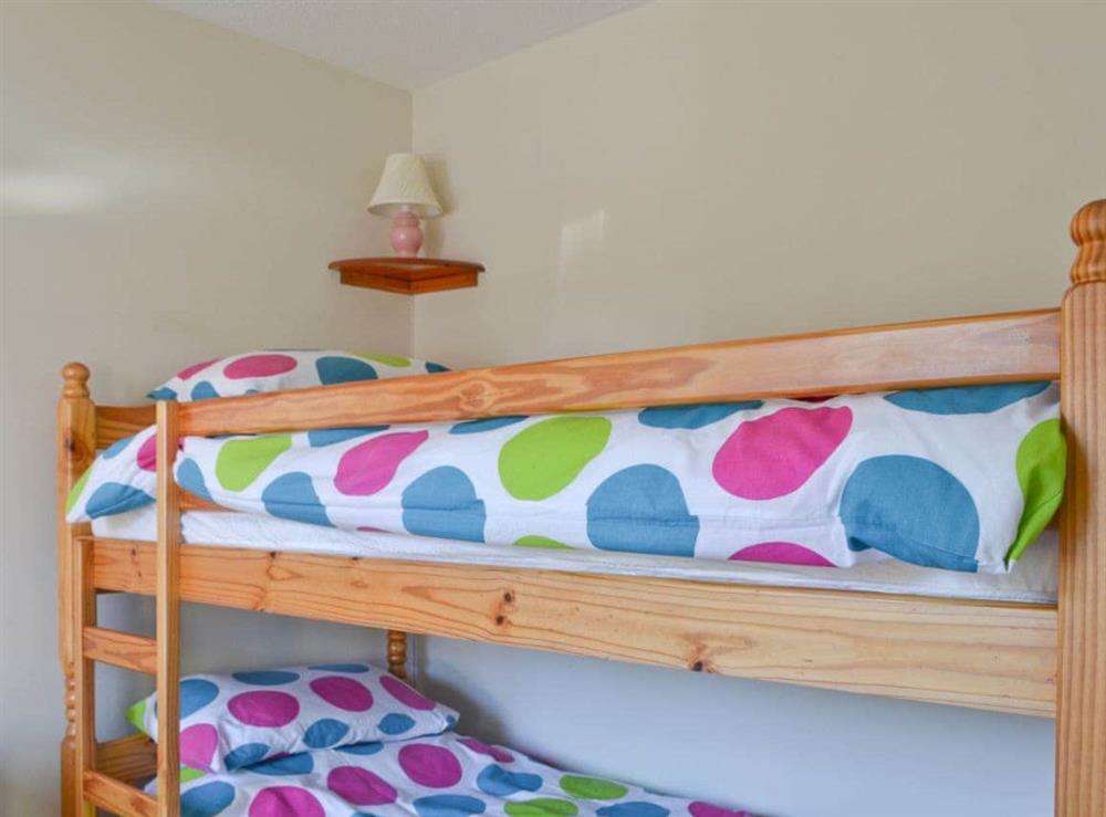 Bunk bedroom with additional single bed (photo 2) at White Heathers in Aviemore, Inverness-Shire