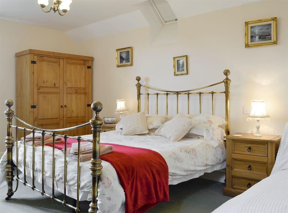 Relaxing family bedroom with a double and a single bed at White Hill Farm Cottage in Wonastow, near Monmouth, Monmouthshire, Gwent