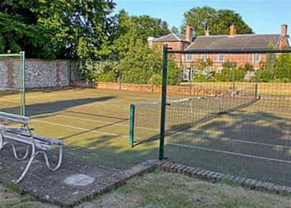 Tennis court at White House Farm in Fring, near Kings Lynn, Norfolk