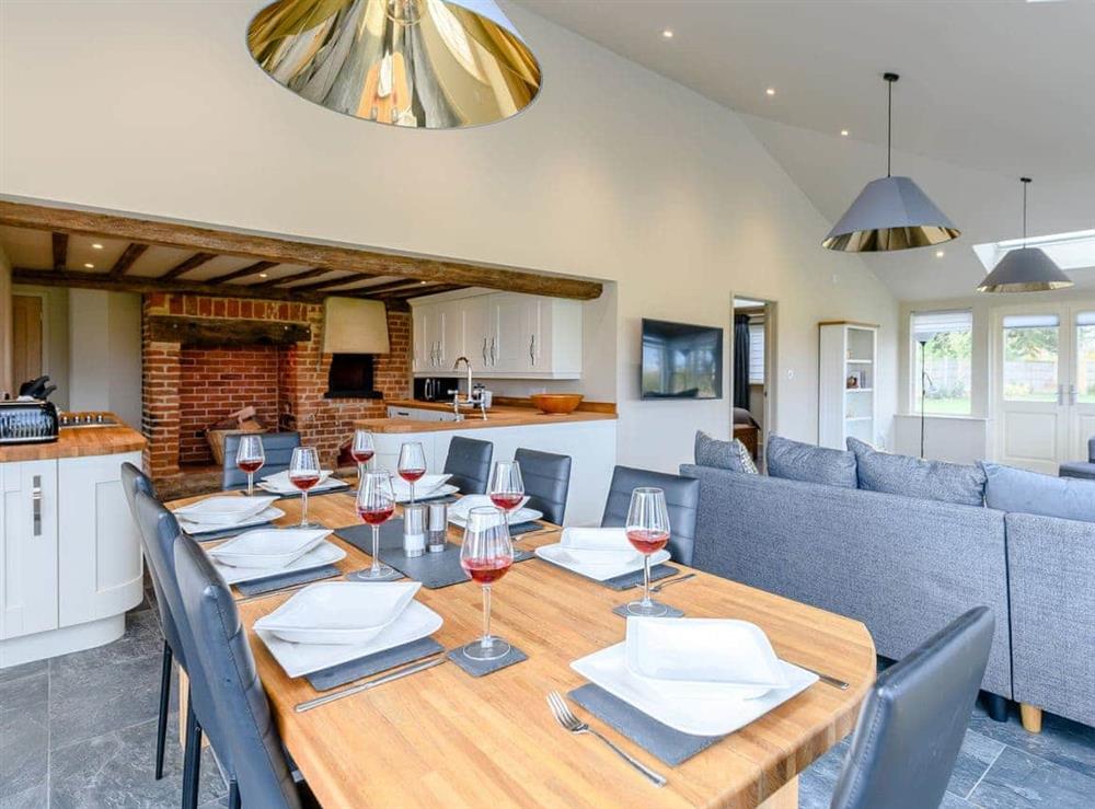 Dining area and adjacent kitchen at Heveningham Farmhouse, 