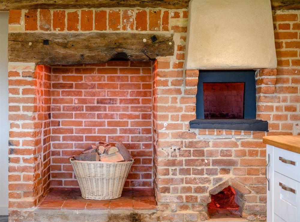 Historic brick-built bread oven in the kitchen at Heveningham Farmhouse, 