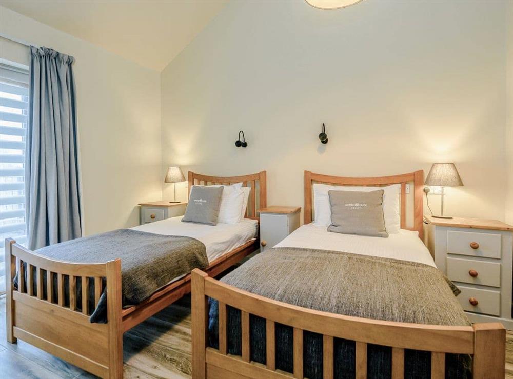 Inviting twin bedroom at Holton Barn, 
