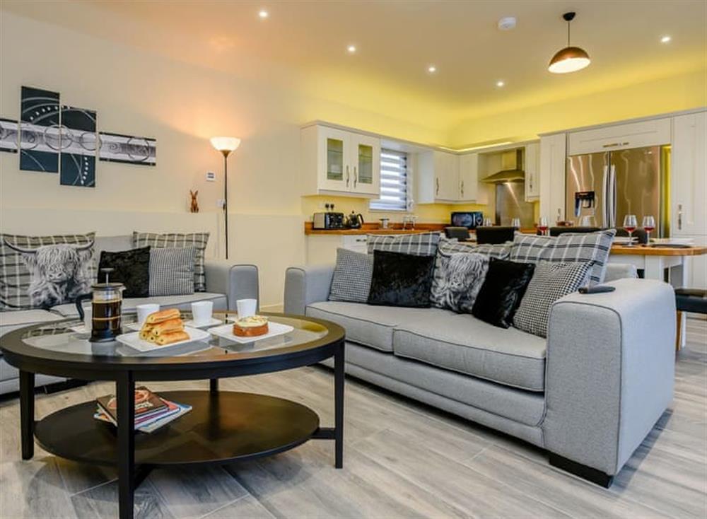 Attractive open plan living space with tiled floor at Walpole Barn, 