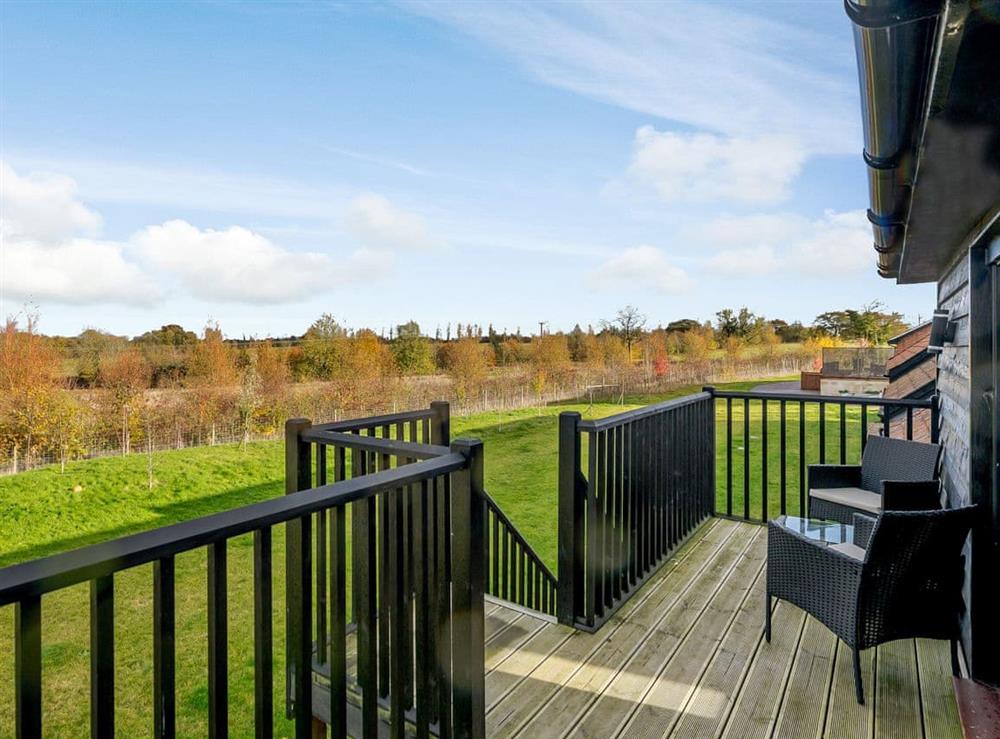 Balcony with outdoor furniture and rural views (photo 2) at Yoxford Barn, 