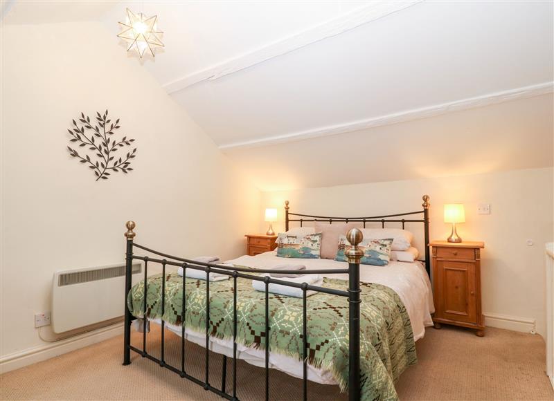 This is the bedroom at White Lilac Cottage, Brynsiencyn