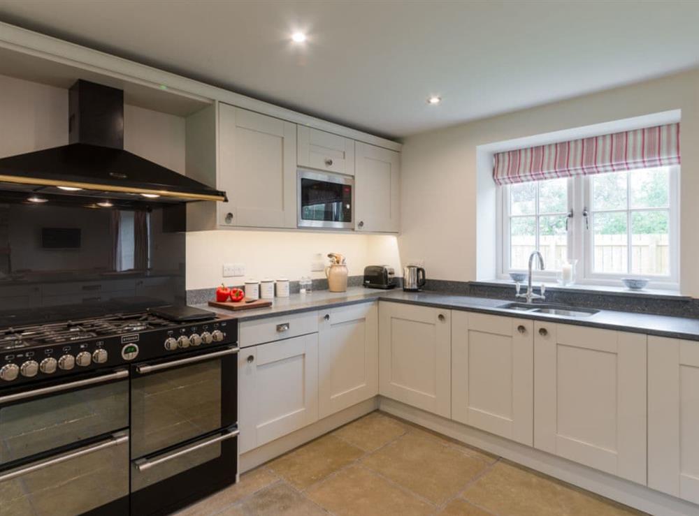 Kitchen with range style cooker at White Lodge Cottage in Carlton Miniott, near Thirsk, North Yorkshire